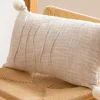 Coussin 30x50cm naturel pompons